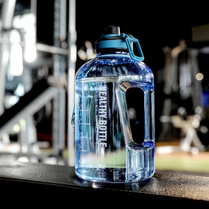 Detail of blue gradient sports bottle showing time markers and hydration reminders