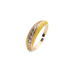 Detail of adjustable gold ring featuring yellow enamel finish and a row of white zircons