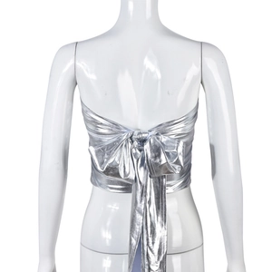 Detailed back view of a silver metallic tube top featuring a large statement bow tie-up