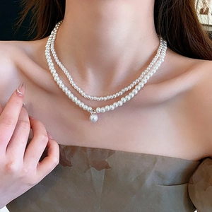 Double layer pearl necklace for women featuring a sparkling rhinestone pendant and soft luster