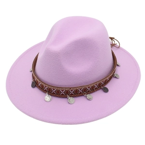 Detail of purple wide brim felt hat with ethnic brown band and silver coin pendants