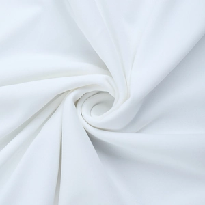 Macro shot of elegant white pleated fabric texture with premium drapery and soft folds