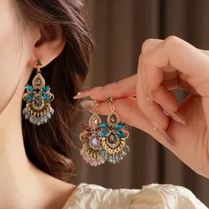 Luxurious bohemian tassel drop earrings with colorful crystals and beaded teardrops