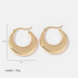 Detailed view of chunky golden crescent hoop earrings with high-polish mirror finish