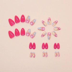 Glossy almond-shaped press-on nails with peach pink and floral graffiti designs