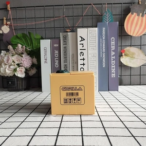 Electric gorilla money box toy featuring a yellow crate design with barcode graphics