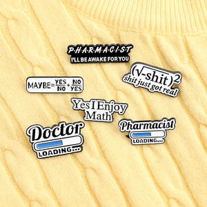 Detail showing various medical enamel pins with Doctor and Pharmacist text on a sweater