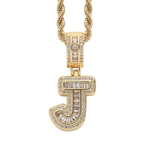 Detail view of iced-out letter J pendant with square zircons and golden rope chain