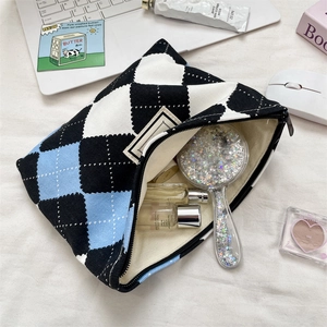 Detail of Korean checkered toiletry bag showing woven texture and spacious interior storage