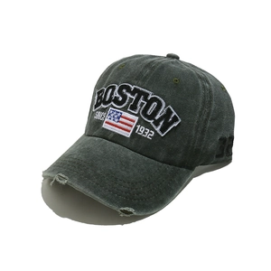 Detail of washed green Boston embroidery baseball cap with distressed brim and vintage flag