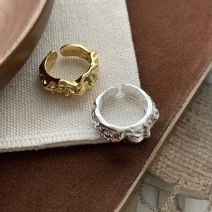 Close-up of S925 hallmark on inner band of adjustable lava texture metal ring