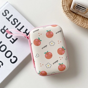 Detail of cute orange pattern portable hard shell case for digital accessories