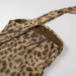Detail of leopard print mesh fabric showing the neckline and side ruched texture