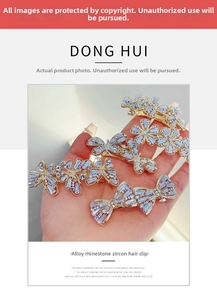 Detail of alloy hair clips with sparkling rhinestones and cubic zirconia bow shapes