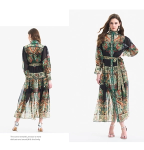 Close-up of bohemian paisley print texture on lantern sleeves and ruffles dress
