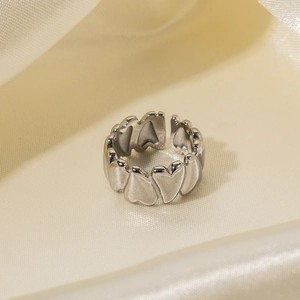 Silver stainless steel heart-shaped open ring displayed on premium silk fabric