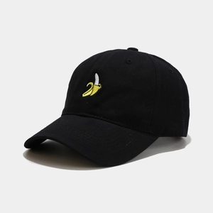 Detailed close-up of a black cotton baseball cap featuring 3D yellow banana embroidery