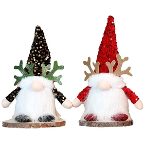 Set of two glowing Christmas gnomes with sequins antlers and wooden base on white backdrop