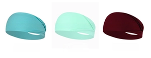 Detalle de cintas elásticas para yoga con diseño de pliegues cruzados en tres colores