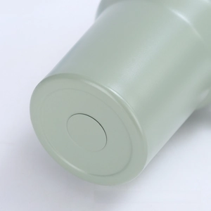 Detailed close-up of the light green matte stainless steel bottom of the 40oz insulated cup