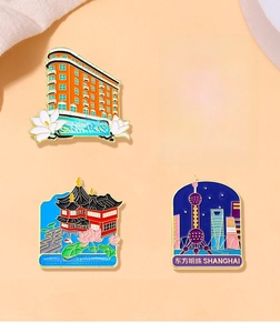 Detailed view of four Shanghai landmark enamel pins including Oriental Pearl and Wukang Building
