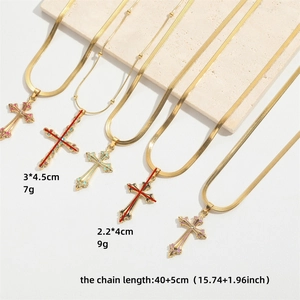 Gold cross pendant necklaces with snake and bead chains shown in varied sizes and weights