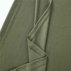 Close-up of army green fitness shorts with breathable mesh fabric and double stitching