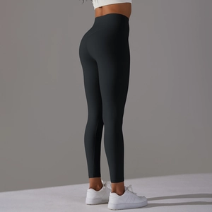 Detail view of high waist yoga leggings with seamless hip-lifting fit and matte texture