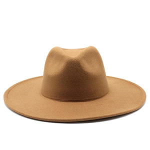 Detail view of a camel wool felt wide brim jazz fedora hat with a flat brim design