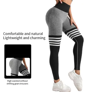 High-waisted yoga leggings with gray patchwork and four white stripes on thigh