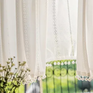 French style white lace curtain with geometric patterns and playful pom-pom ball trim