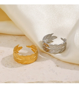 Detailed view of adjustable stainless steel feather rings in gold and silver finishes