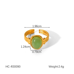 Detailed view of adjustable gold-plated ring with green oval tiger eye stone and dimensions