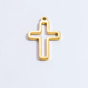 Detailed view of a gold-plated hollow cross pendant with a polished metallic finish