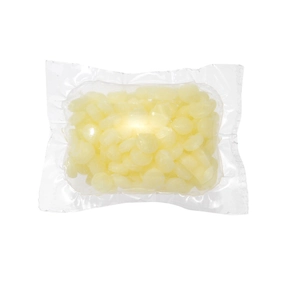 Long-lasting yellow laundry scent beads in clear plastic bag isolated on white background
