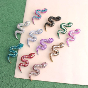 Detailed collection of crystal snake brooches in various vibrant colors and alloy finishes