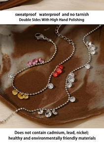 Macro detail of waterproof silver bead bracelets with colorful zircon teardrop pendants