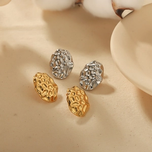 Textured lava-style oval stud earrings in gold and silver stainless steel finish