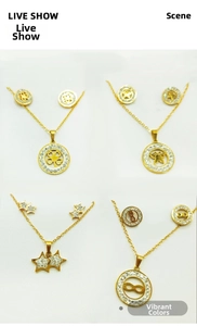 Detail of four gold-plated stainless steel jewelry sets with clover and butterfly patterns