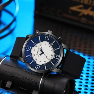 Sporty men's black silicone watch with blue and white dial on high-tech textured background