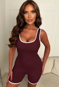 Detail of the dark red Y2K athletic romper with contrast white binding and slim fit design