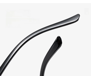 Detail shot of black curved sunglasses temples with high-gloss polished finish