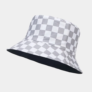 Detailed side view of a gray and white checkered bucket hat with durable canvas texture
