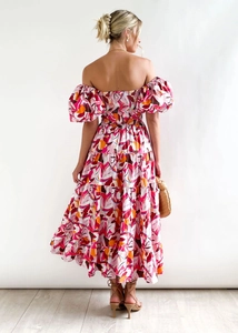 Rear view of floral off-shoulder maxi dress with tiered skirt and elastic smocked back
