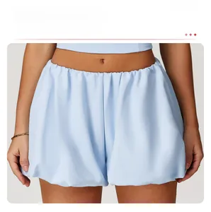 Macro shot of light blue high-waisted bubble yoga shorts with an elastic waistband