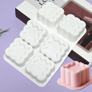 Detailed view of white 6-cavity silicone cloud mold with a finished pink dessert on top