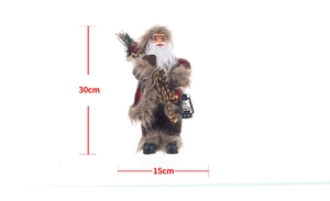Detail view of 30cm standing Santa Claus figurine with lantern and backpack tree