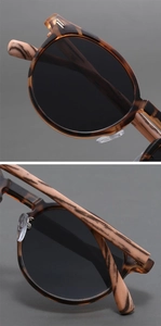 Macro detail of retro round matte sunglasses showing wood-grain texture and metal hinge