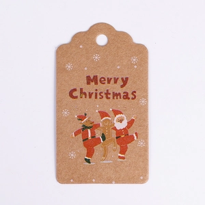Close-up of Merry Christmas kraft paper gift tags with festive reindeer and Santa prints