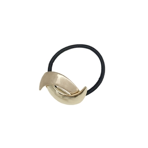 Sleek crescent moon gold metal hair cuff with black elastic tie on white background